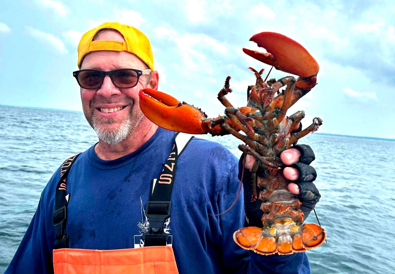 Adirondack-Seafood-Mike-Holding-Lobsters
