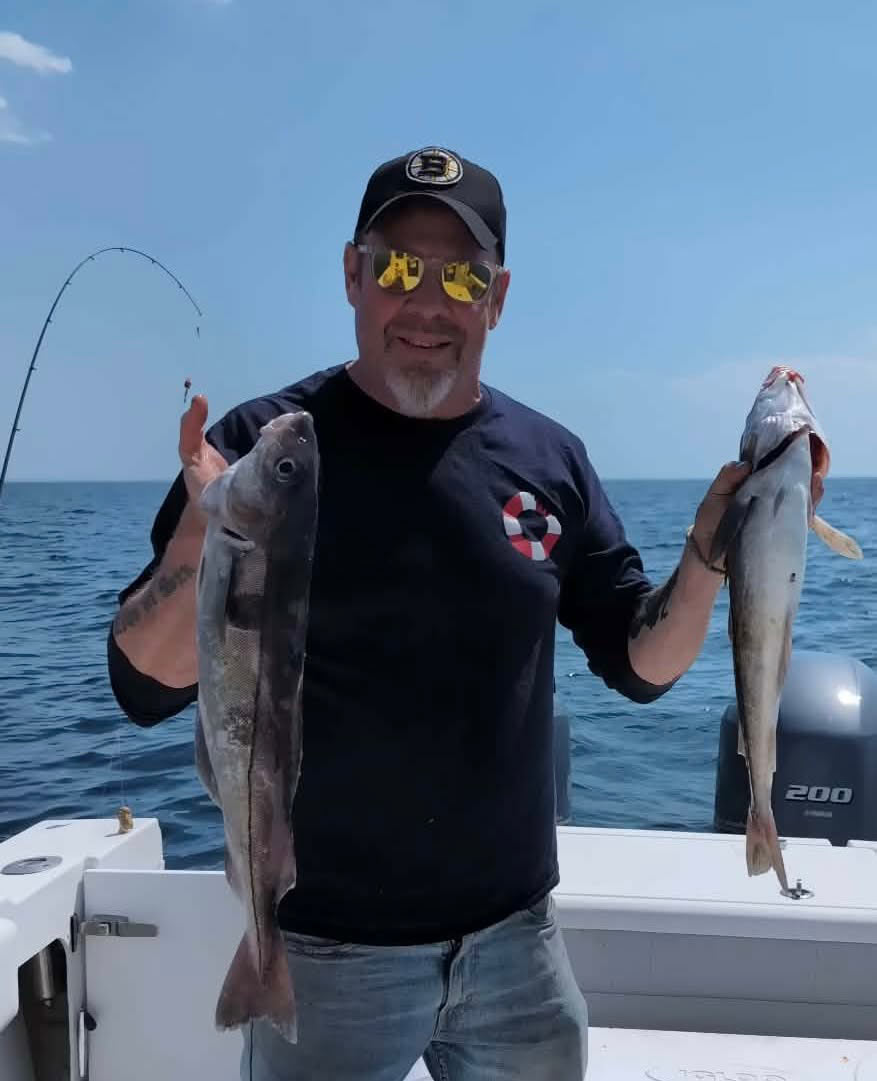 Adirondack-Seafood-Mike-On-Boat-With-Fish