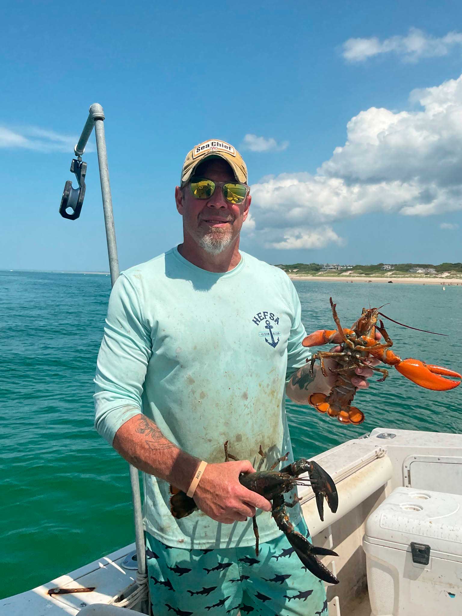 Adirondack-Seafood-Mike-On-Boat-With-Lobsters